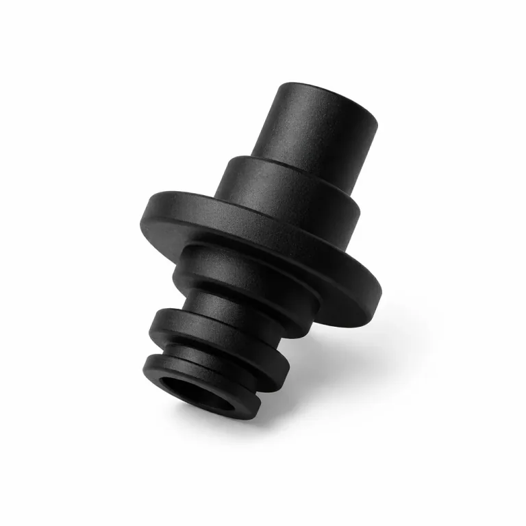 Black precision injection-moulded component made by Parshwa Plastics